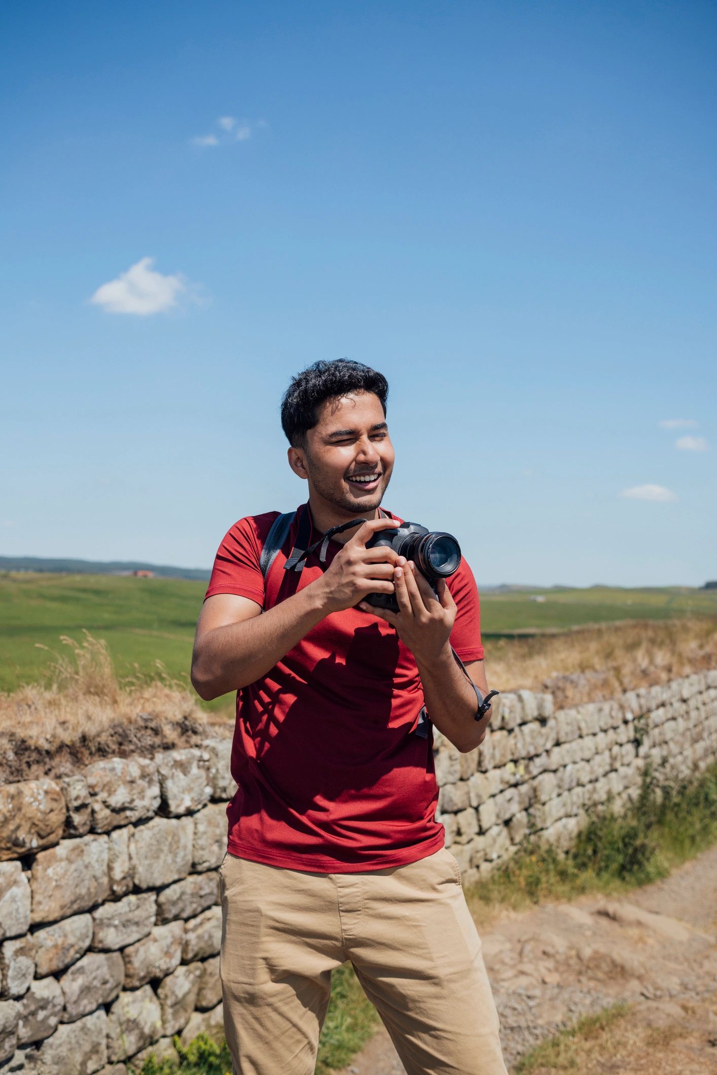 Photographer capturing a landscape outdoors